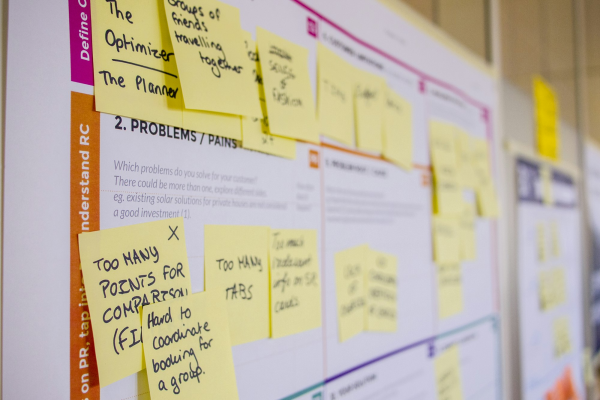 Post-it notes on a planning board - mapping the stages of a delivery pipeline