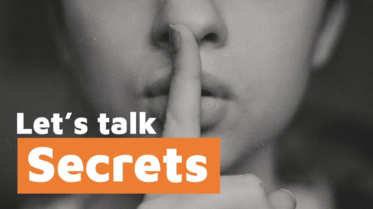 Black and white photo of a person with finger to lips, overlaid with the text 'Let's talk Secrets'