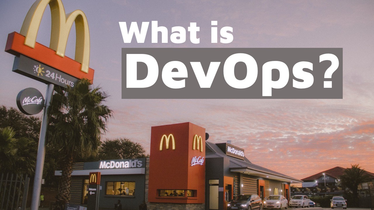 McDonald's drive-through restaurant at dusk with "What is DevOps?" text overlay